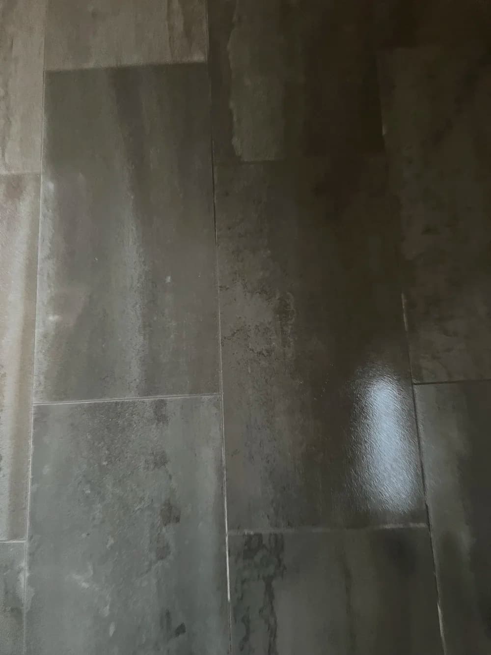 Large-format dark slate tile floor